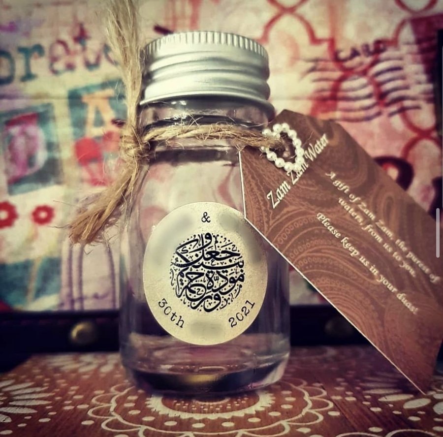 50ml round clear glass favour bottle with a silver screw cap